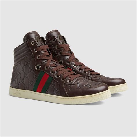 brown gucci high top sneakers.